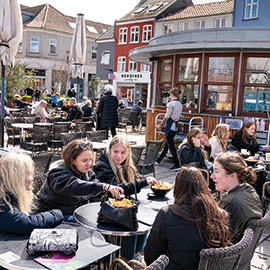 Denmark—April 2021. Diners seated outside a recently reopened restaurant in Roskilde.