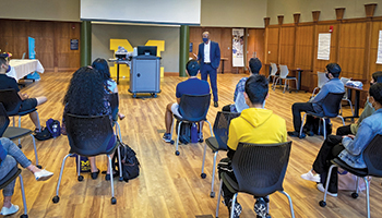 Dean Bowman speaks with first generation students and international students during orientation.