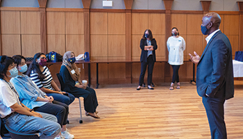 Dean Bowman speaks with first generation students and international students during orientation.