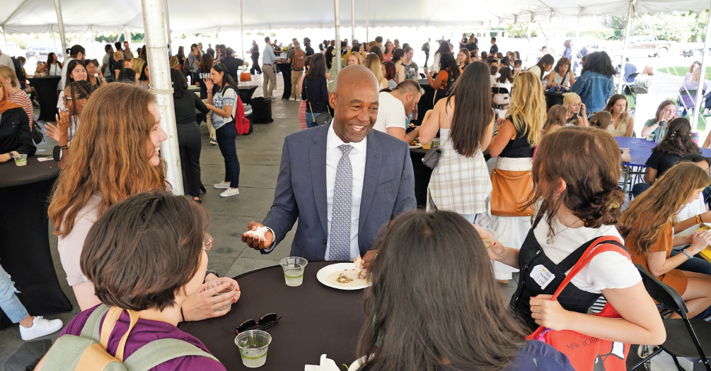 Dean Bowman speaking with incoming students during orientation activities 