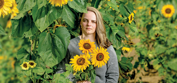 Oksana Fedorak in a field of sunflowers