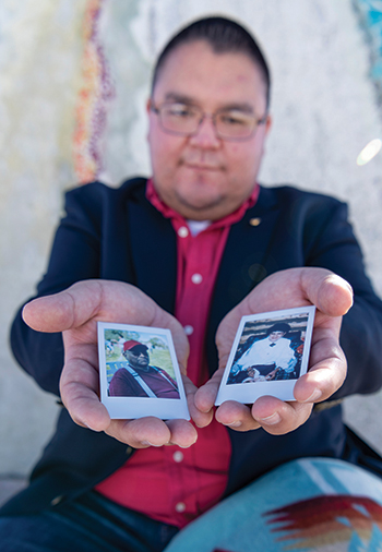 Joel Begay, MPH ’18, holds photos of his grandparents Woodrow and Lucy.