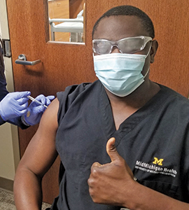 Utibe Effiong, MPH ’14, receiving a COVID-19 vaccine at the MidMichigan Health Center in Mount Pleasant.