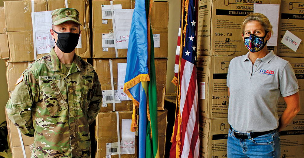 Robin Martz, MSW ’03, MPH ’03, in Rwanda with Major Joshua Hudson, receiving a delivery of personal protective equipment for Rwandan public health officials.