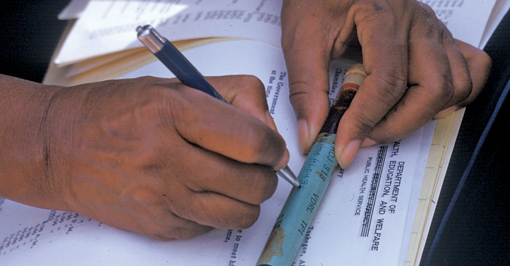 A nurse writes on a vial of blood taken from a man who was included in the Tuskegee syphilis study in Alabama, circa 1950.