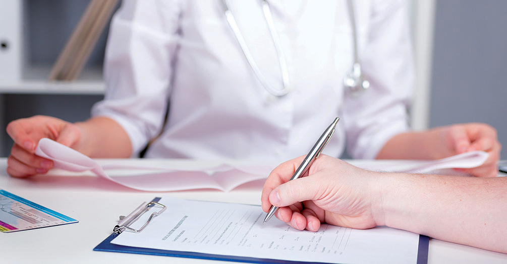 A physician works through an evaluation with a patient