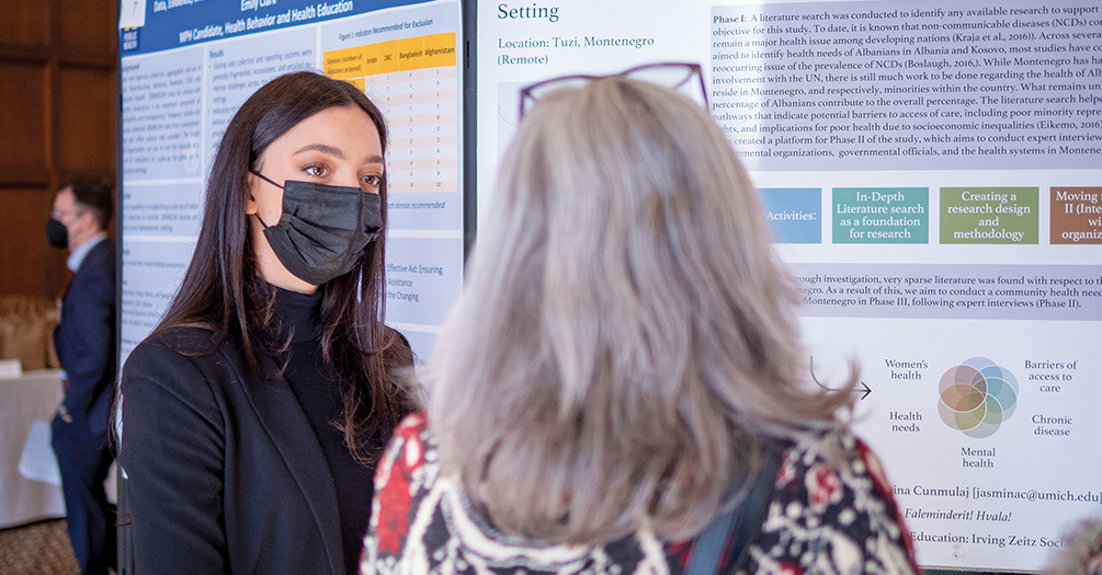 masked woman presenting 