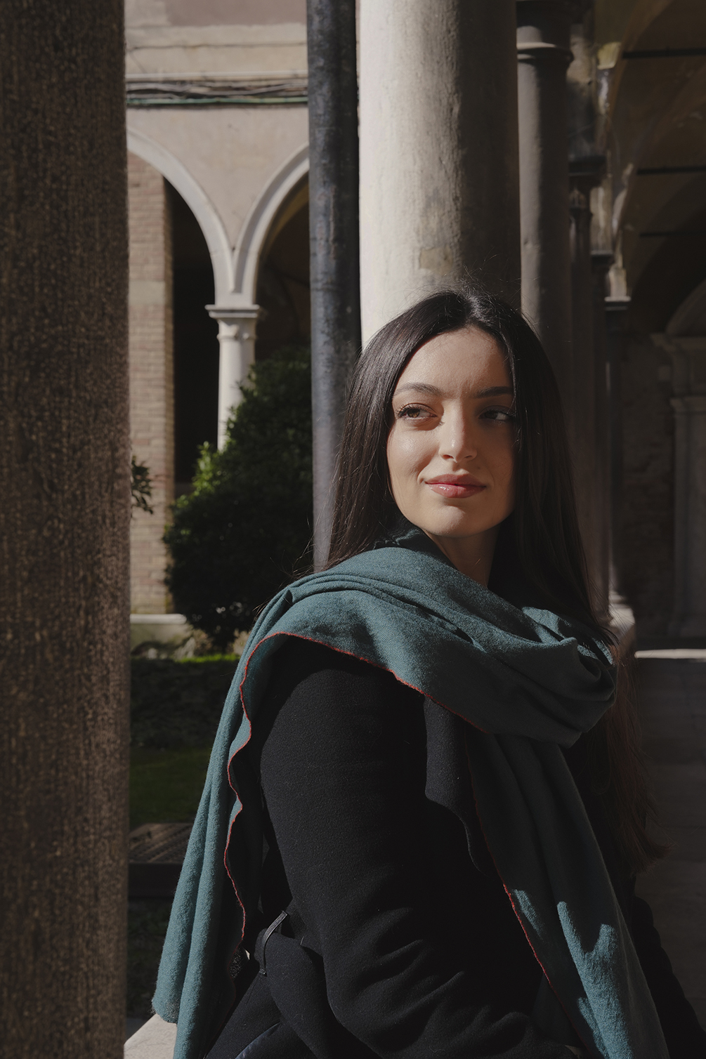 Jasmina Cunmulaj stands with Venice’s oldest hospital in the background