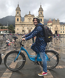 Kelly Charniga, MPH ’17, on her bike on Plaza Bolívar in downtown Bogotá