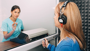 Health tech performing a hearing test