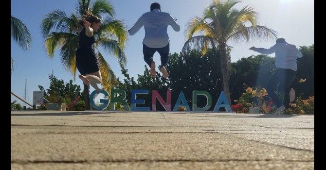 Jumping in front of Grenada letters