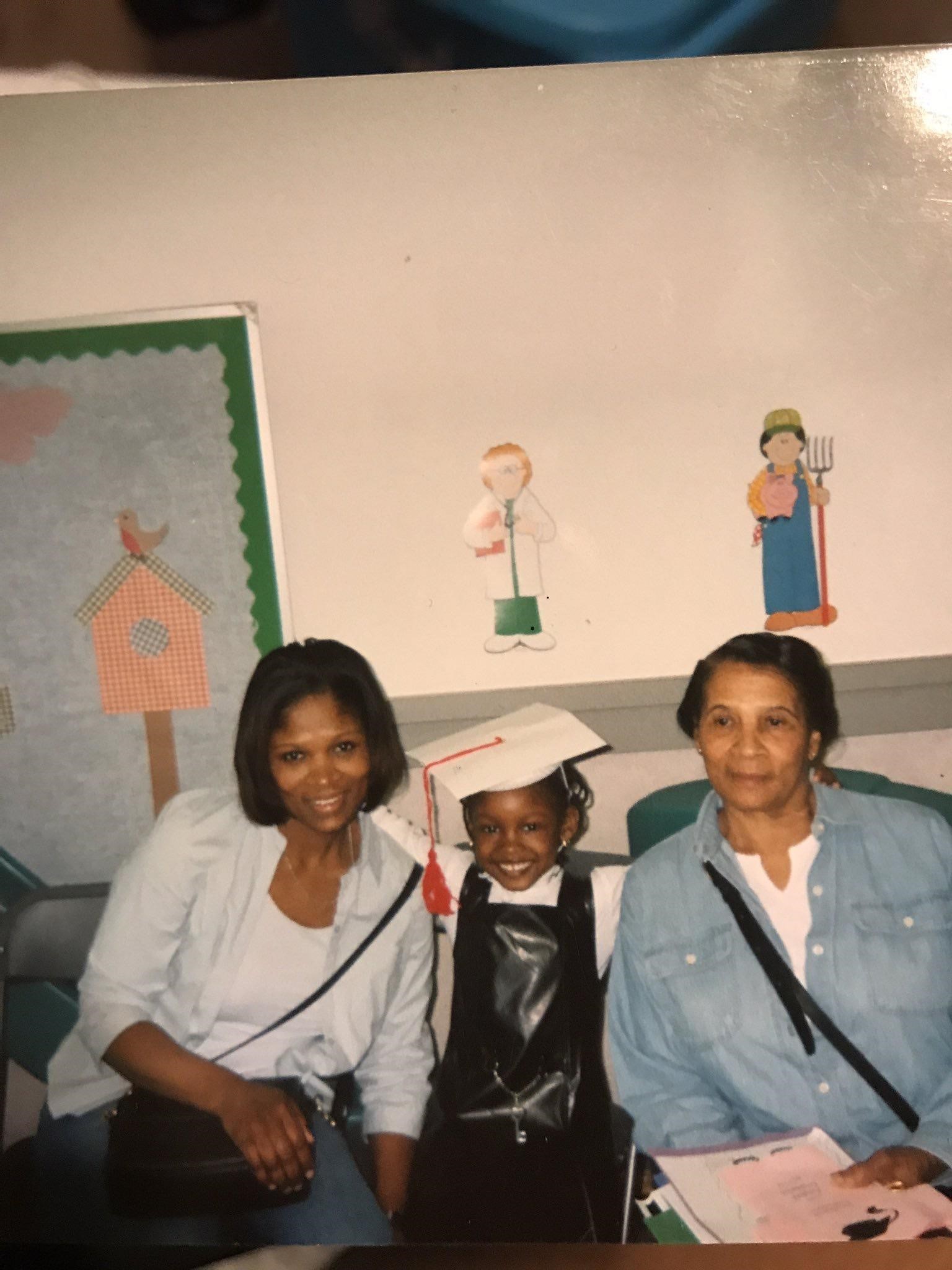 Dania, her mother, and her grandmother at Dania's preschool graduation, 2002