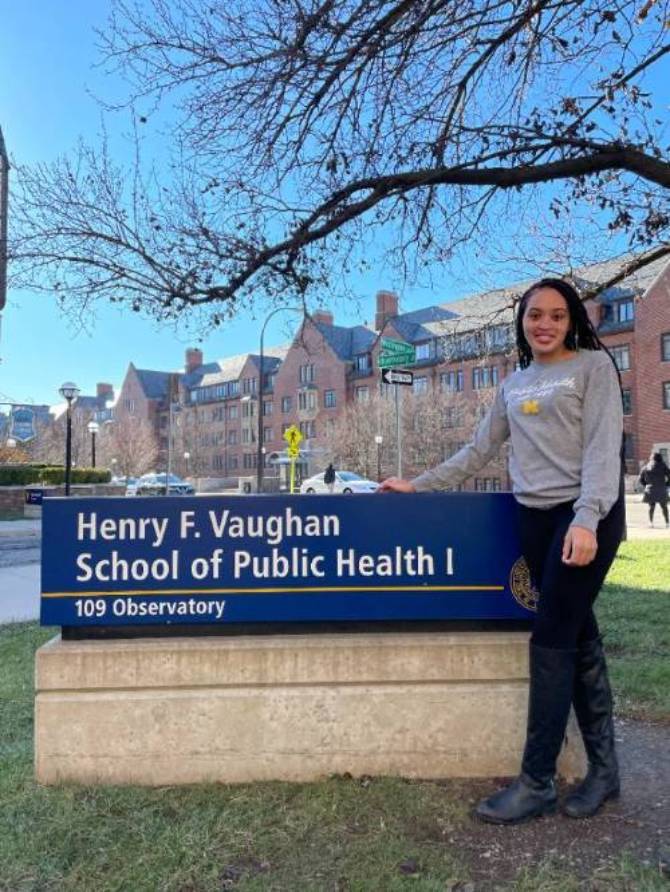 Kamara Gardner in front of SPH sign