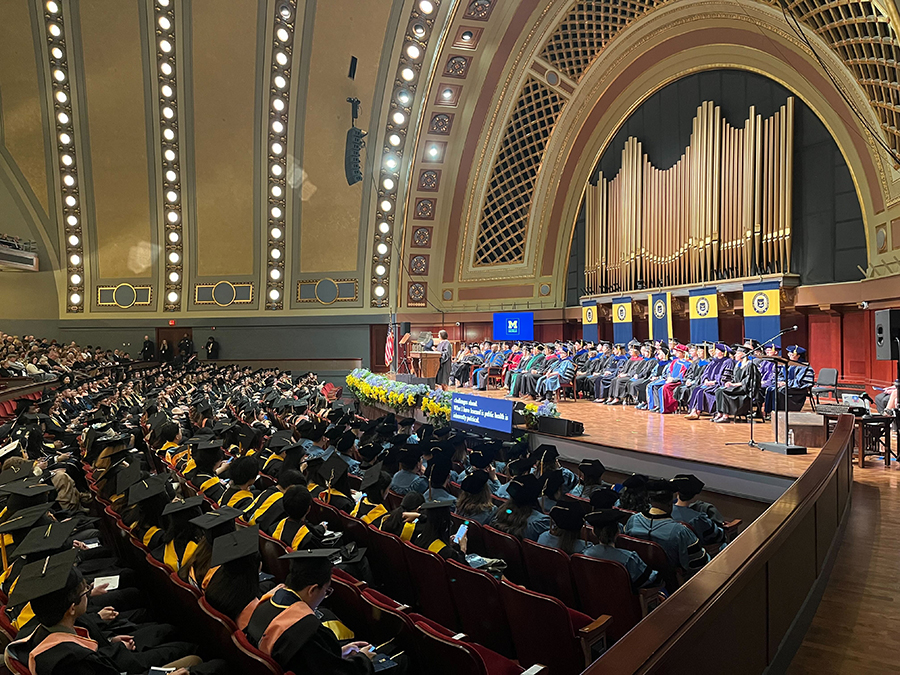 Historic Hill Auditorium crowd during graduation ceremony.