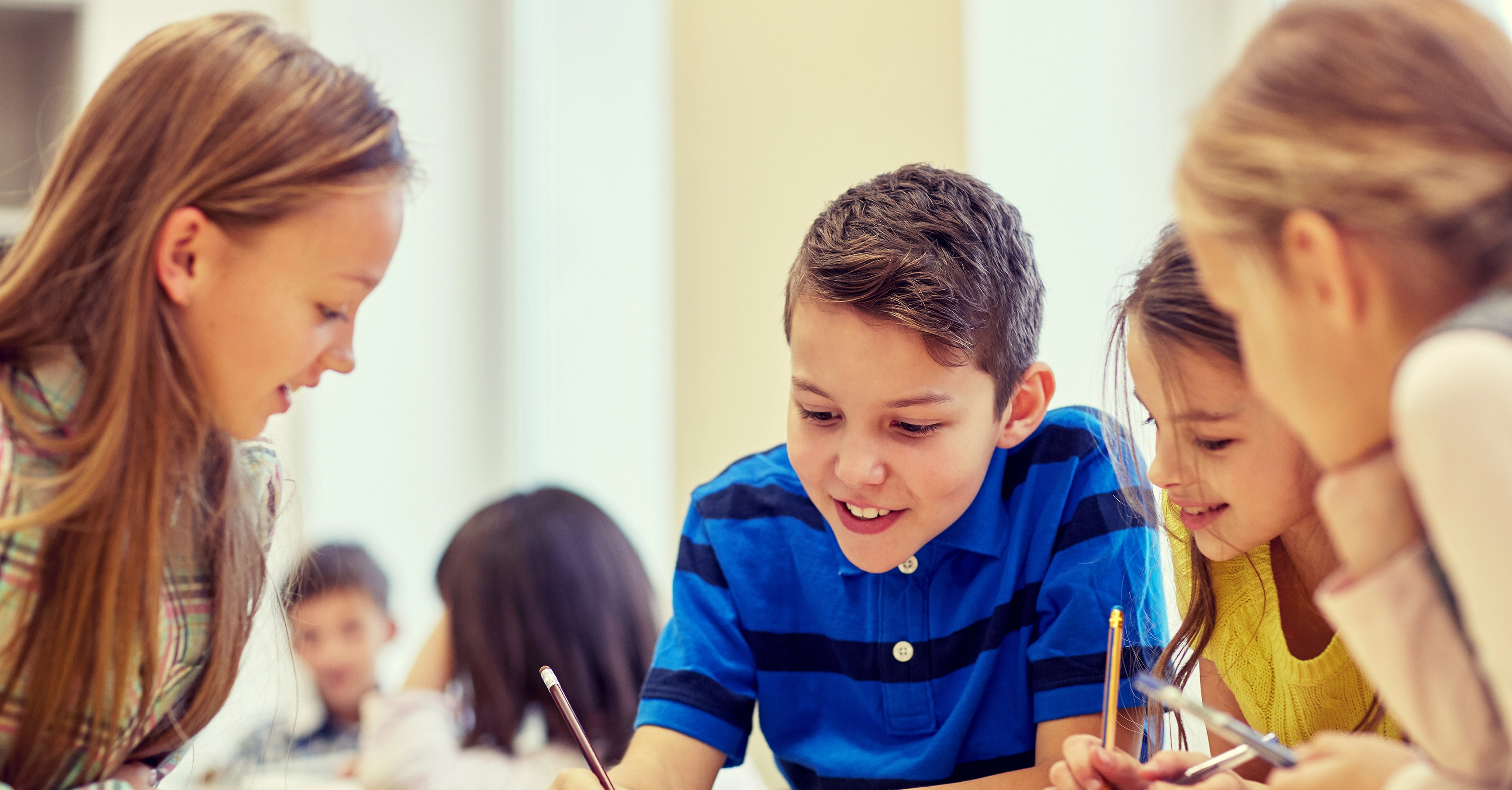 Young students working on a project together. 