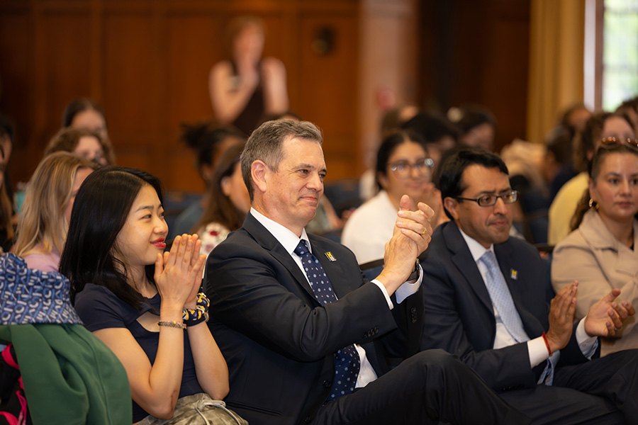 From left, an unidentified female student, Dean Charles B. Holmes, Anand Parekh, and Natasha Bagdasarian.