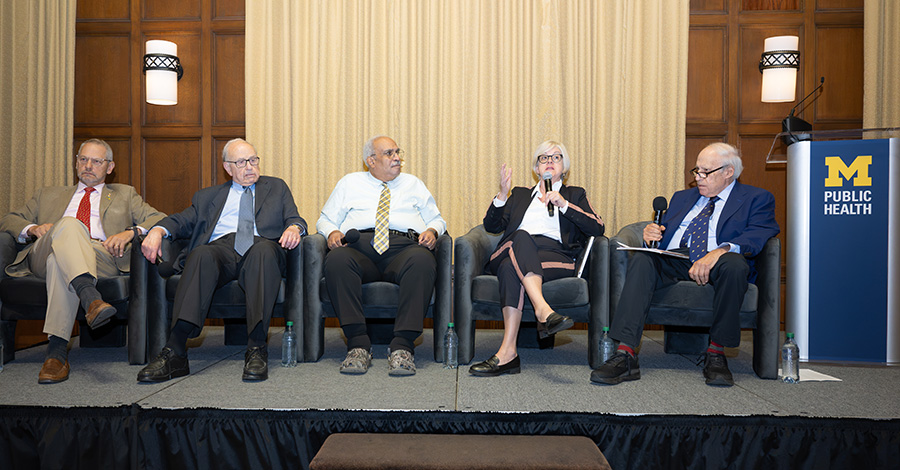 The panel on the stage, from left: Boris Lushniak, Arnold Monto, Georges Benjamin, Marian Moser Jones and Dan Glickman.