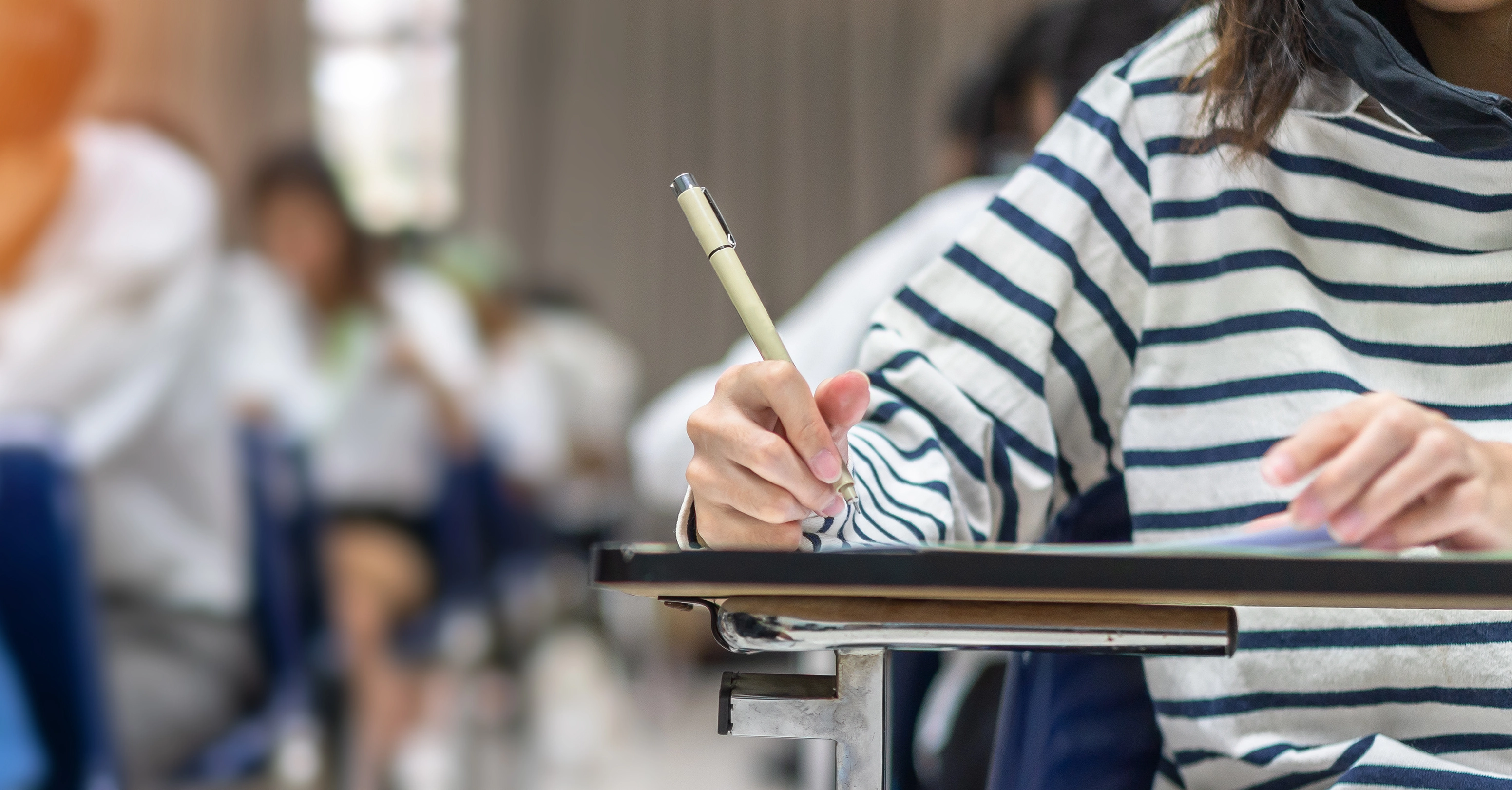 A student working at their desk.