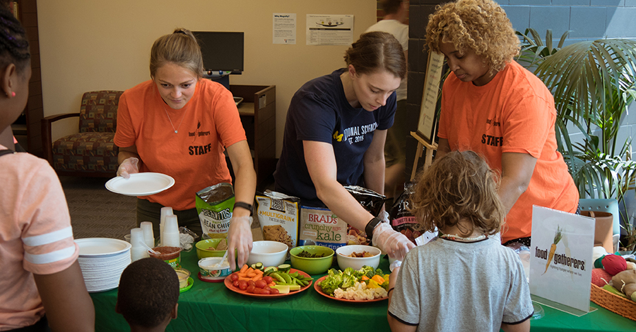 image of children being served at the food gatherers event