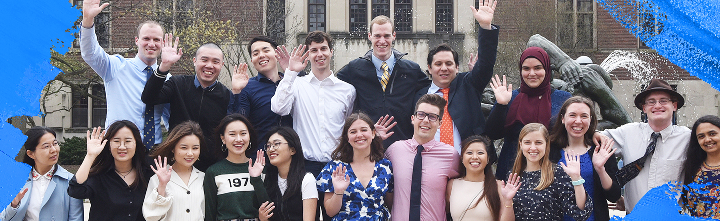 Group of students waving