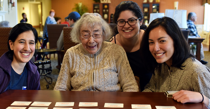 Michigan Public Health students with resident of a care facility