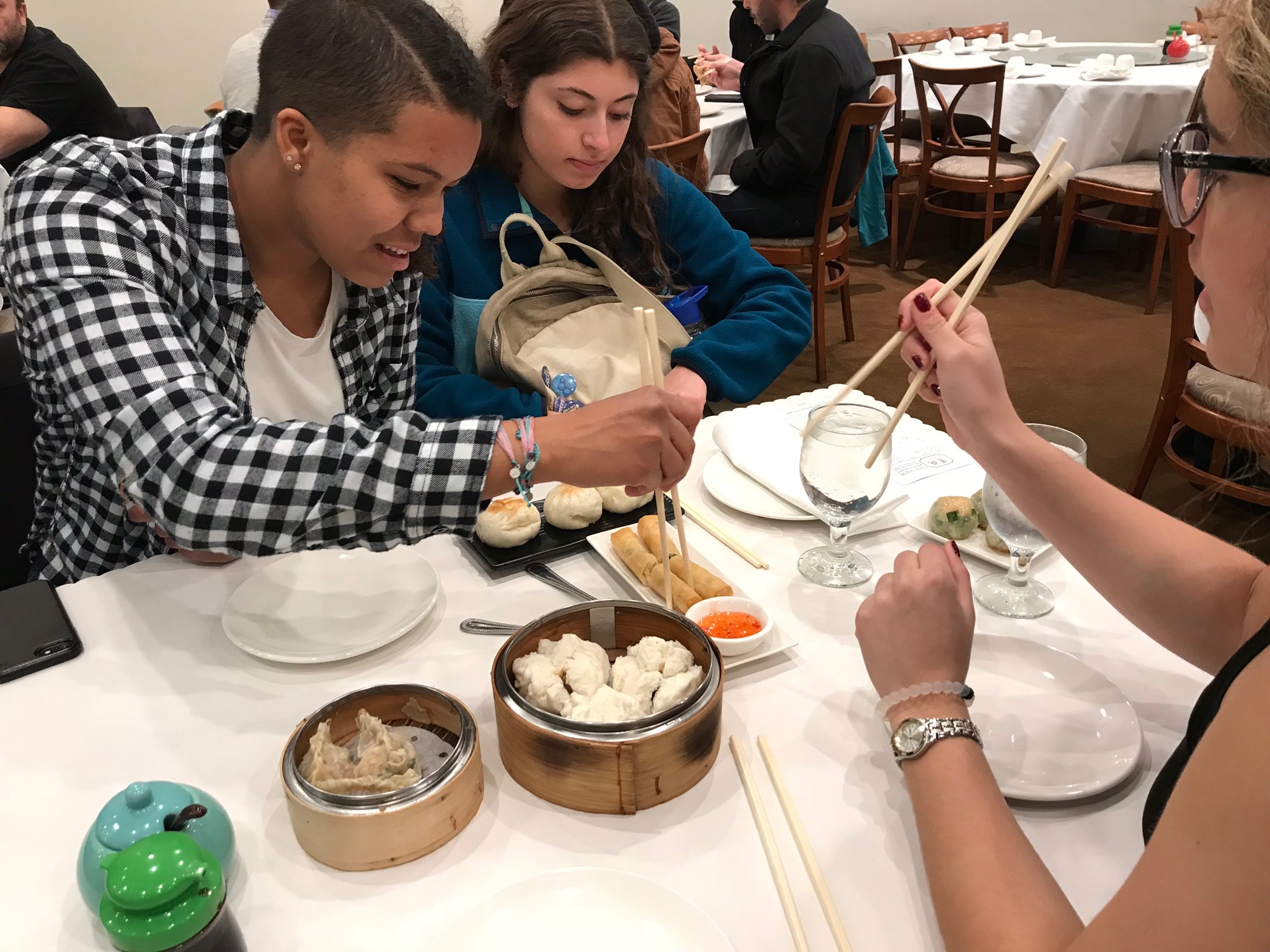 The author breaking bread with friends and family