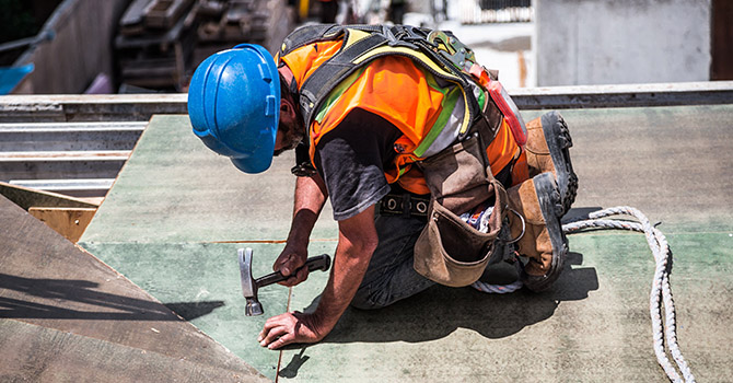 construction worker working on a roof