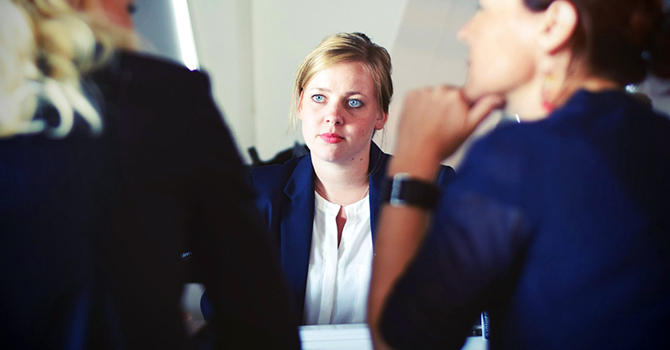 3 people in a business meeting