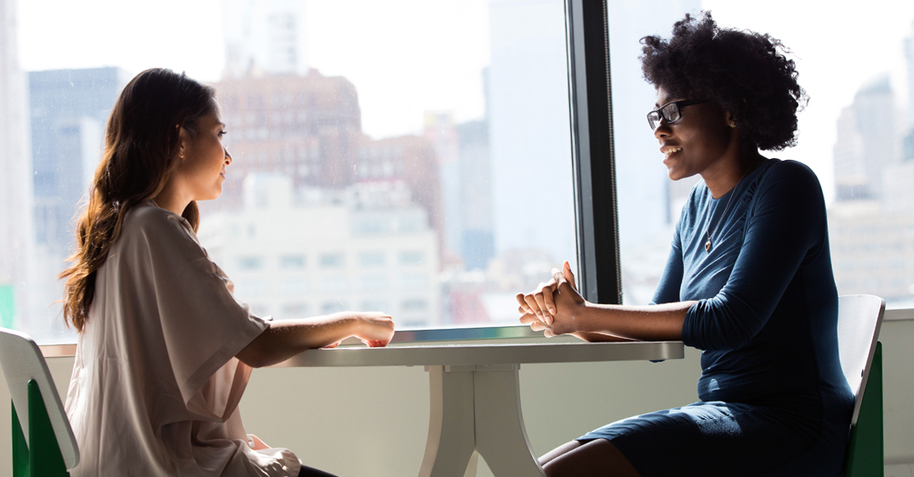 An interview between two people in an urban setting