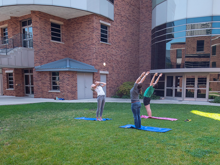 Kate teaching yoga in the courtyard