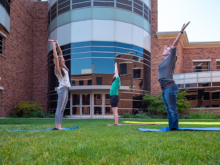 Kate teaching yoga in the courtyard