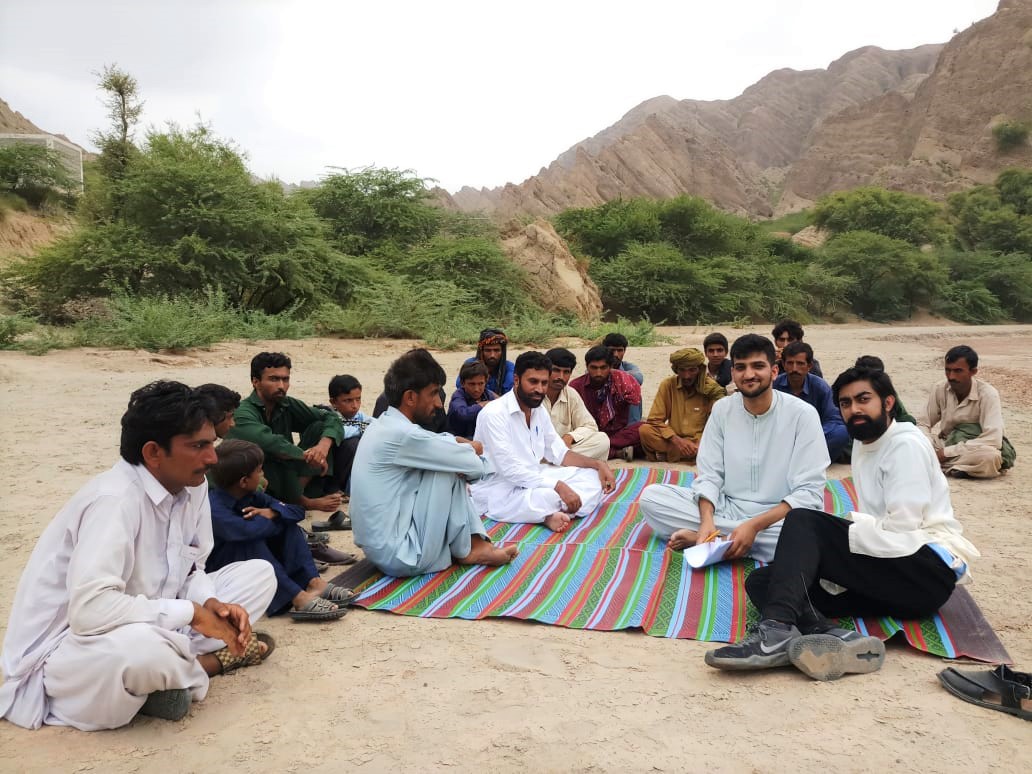 Omar Ilyas (foreground on the right) worked for the American Pakistan Foundation as a research analyst and traveled throughout Pakistan to meet with residents to discuss water contamination and health